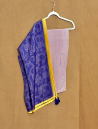 Purple and yellow fabric with a white pattern on a beige background